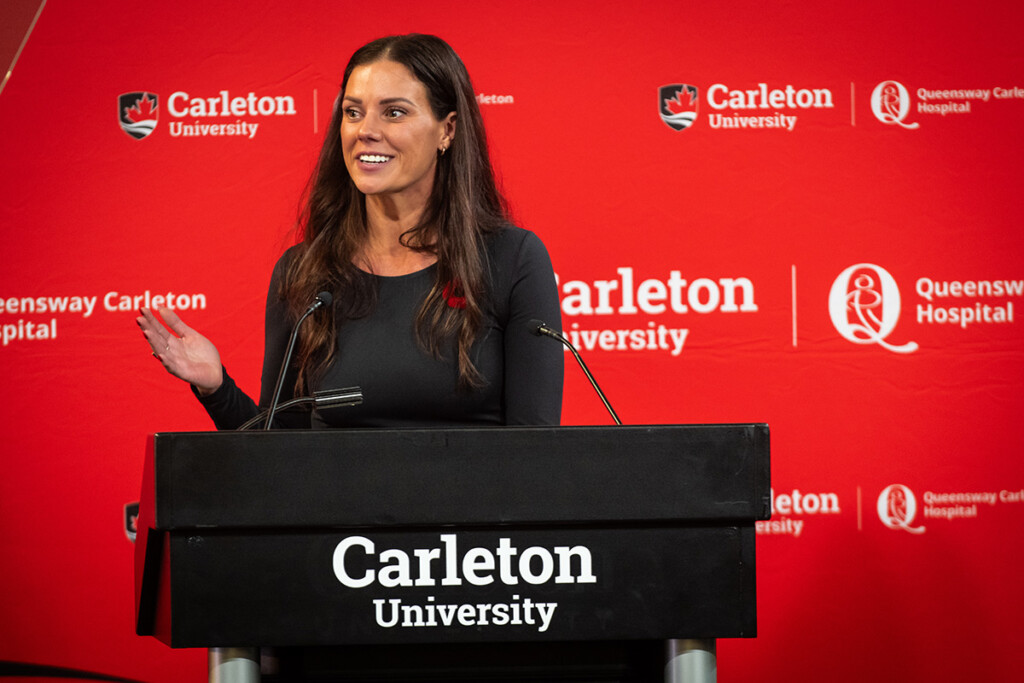Photo of School of Nursing Director, Danielle Manley, standing behind a podium at Carleton Nursing launch event.