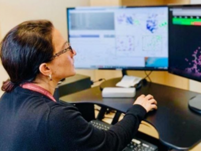 Edna Matta-Camacho at a computer