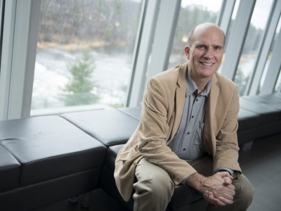 Prof. Richard Ernst sits next to a window.
