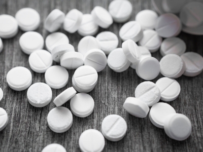 Pills on a wooden table