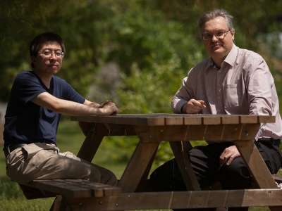 Yue Zhang and Razvan Gornea at a picnic table outside