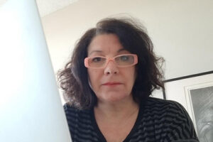 Sandra Gabriele sits at a computer