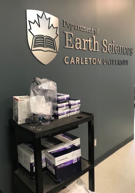 N95 masks, purple nitrile gloves, goggles and a face shield from the Department of Earth Sciences.